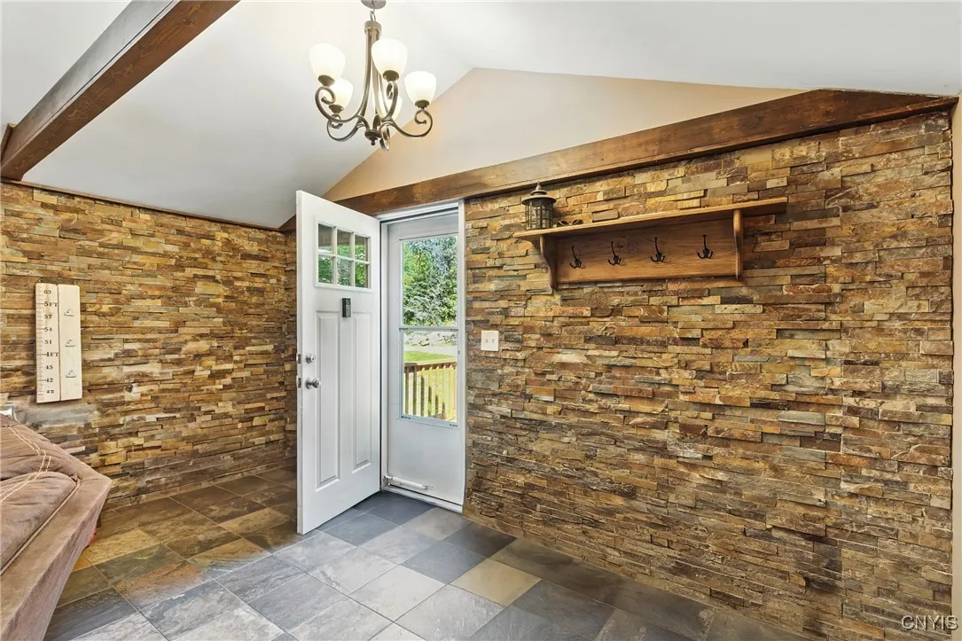 You will enter the home into this great tiled space where shoes and coats can be removed before going into the rest of the home.