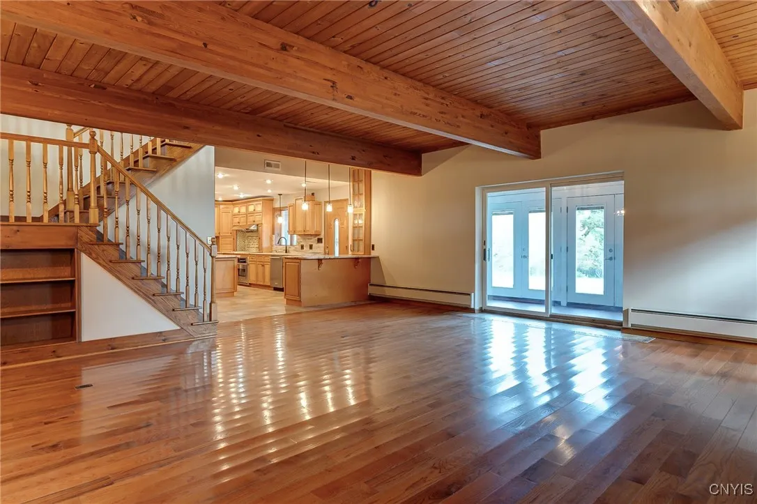 Beautiful knotty pine ceiling in this spacious living area with sliders to the back porch\n
