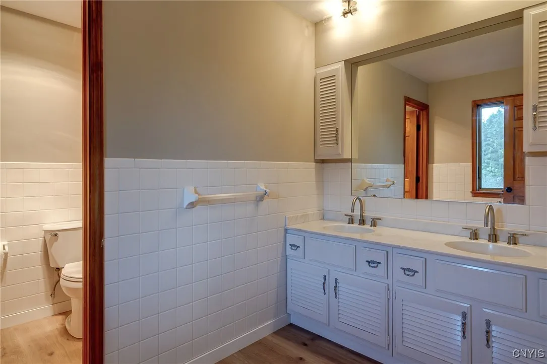 Primary Bath with 2 sinks and separate toilet and shower area