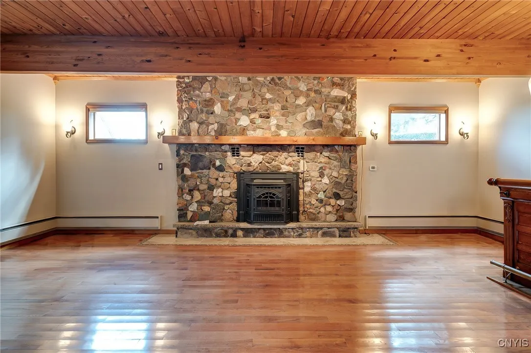 Toasty pellet stove stone fireplace adds ambiance to this space all year long!
