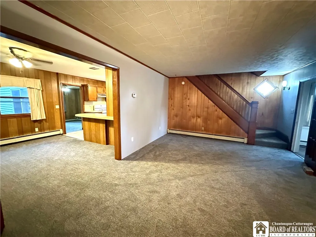 Large living room that opens to the formal dining room and into the kitchen