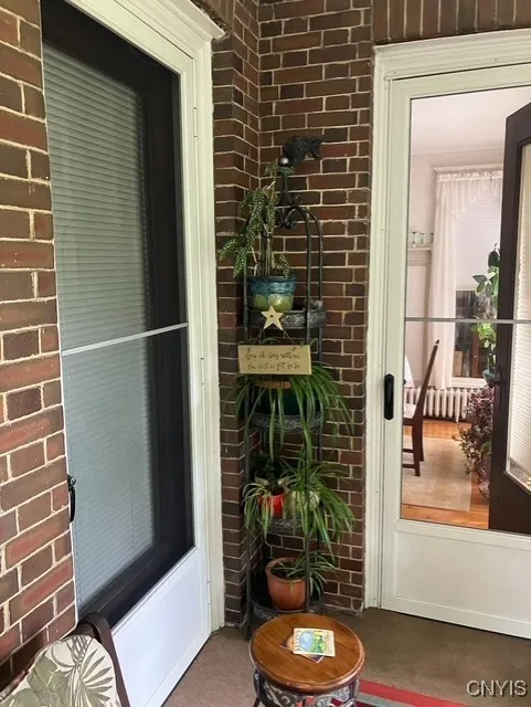 VIEW OF LIVING RM DOOR AND DINING RN DOOR FROM MAIN FLOOR PORCH***