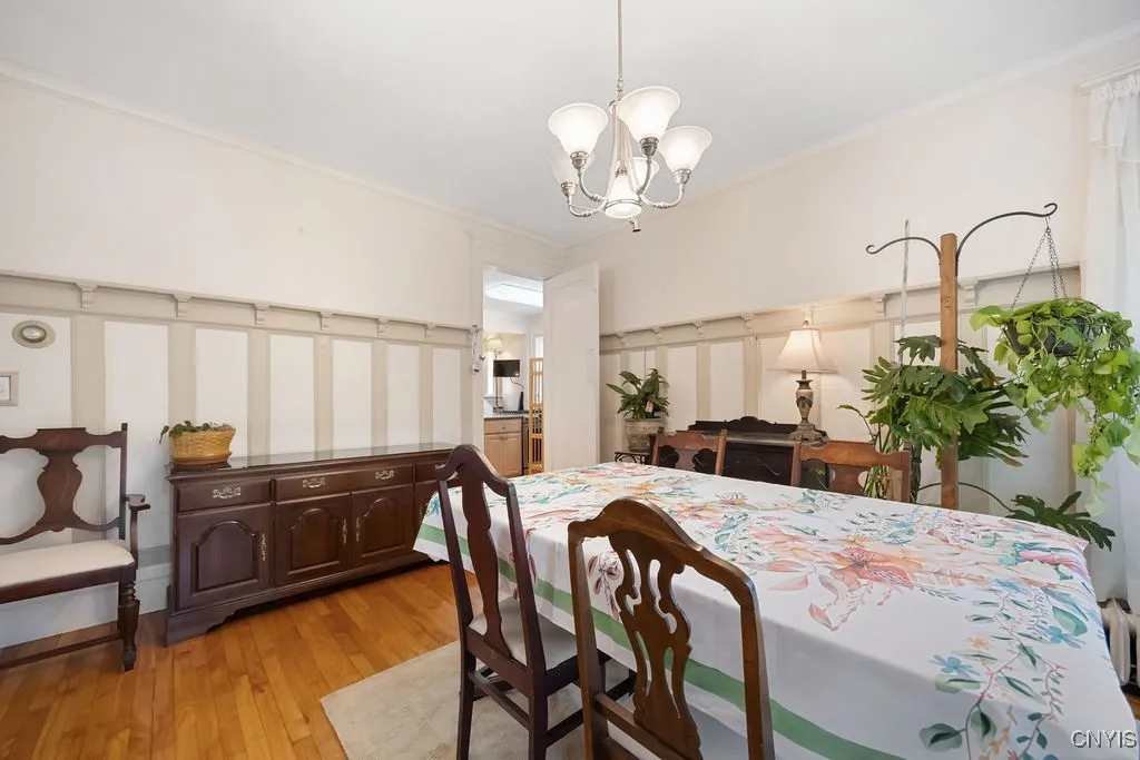 *** VIEW FROM DINING LOOKING INTO KITCHEN***CHARMING BOARD AND BATTEN ON WALLS** TOP OF WITH SHELVES***