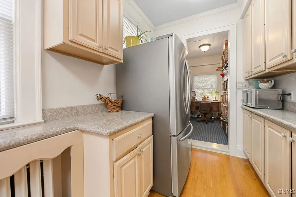 ** VIEW OF WALK IN PANTRY EXTRA CABINETS  MICROWAVE AND REFRIGERATOR ***