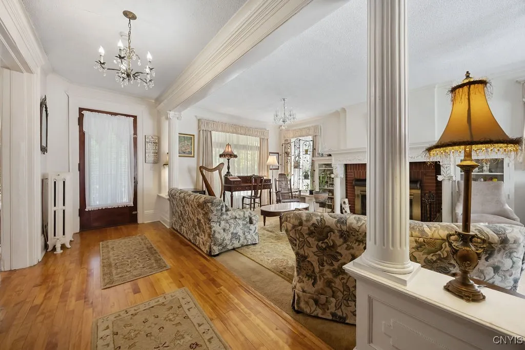 SPACIOUS INSIDE FOYER FEATURING ORIGINAL ARCHITECTURE.**PILLARS &.DETAILED WOODWORK