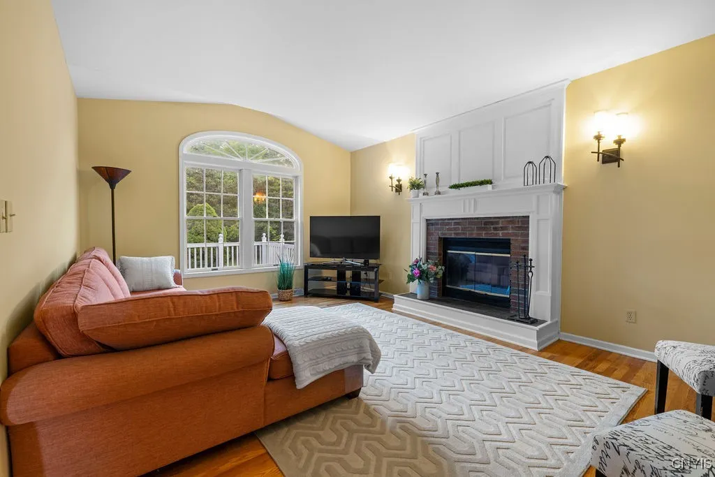 The family room is a nice space to enjoy with the family in front of the wood burning fireplace