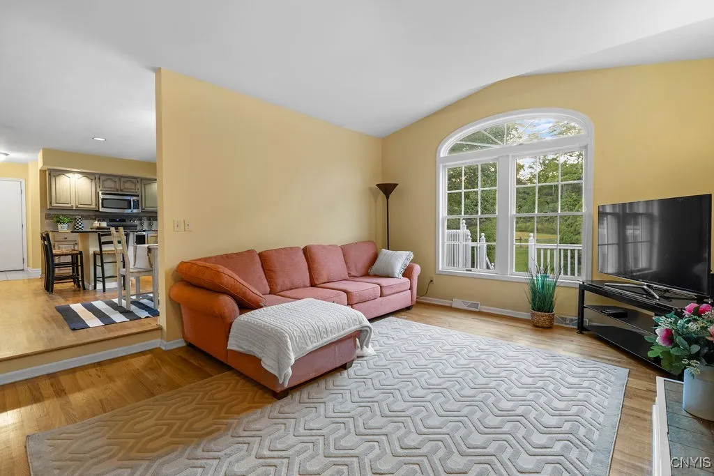A step down from kitchen leads to the family room