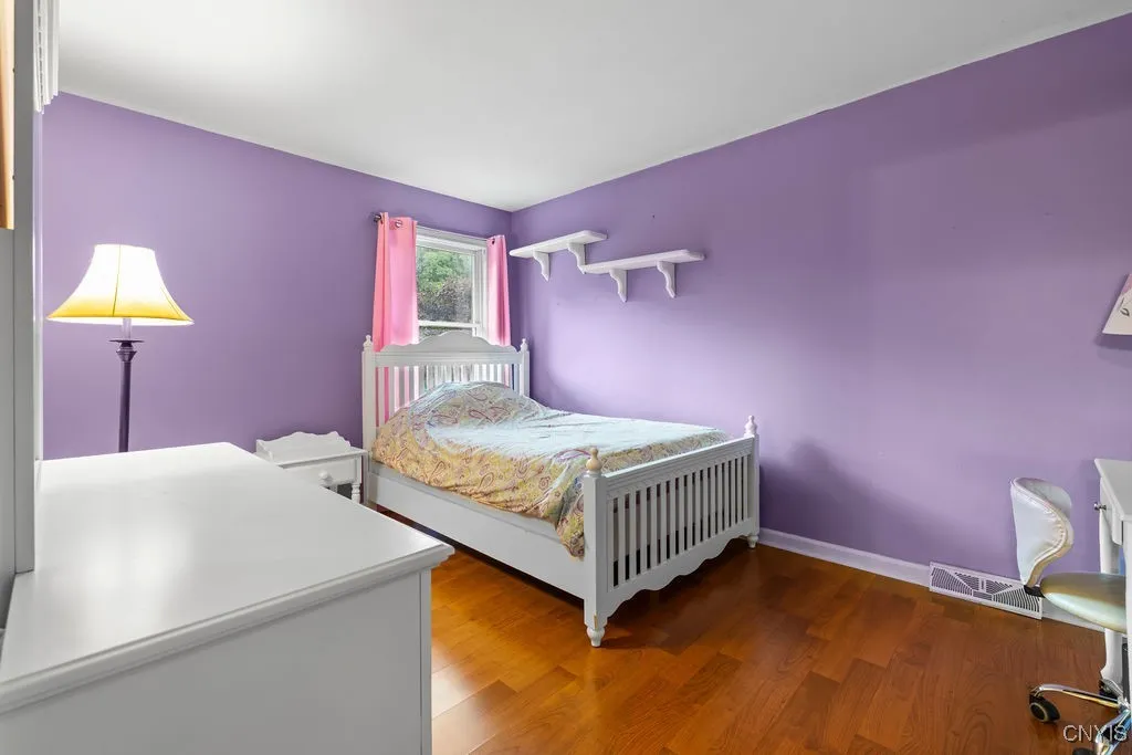 One of the 4 bedrooms with laminet flooring