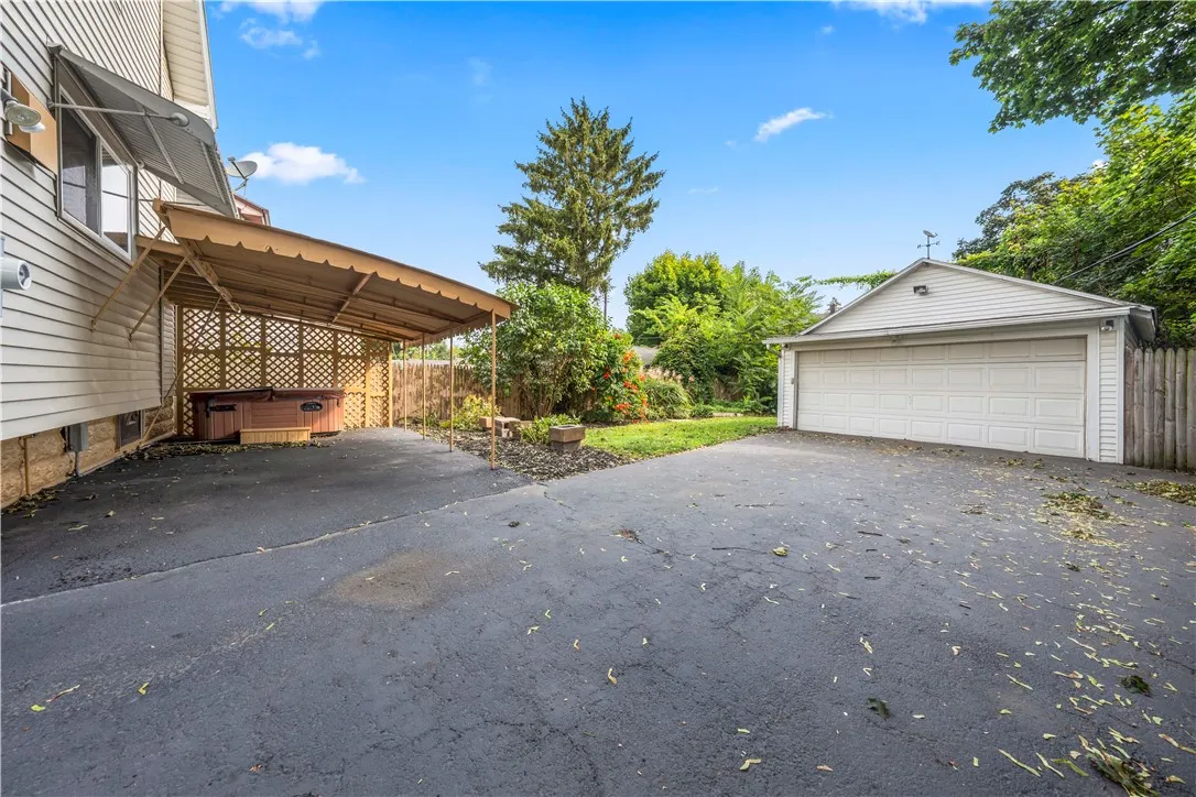 Back of driveway and covered patio