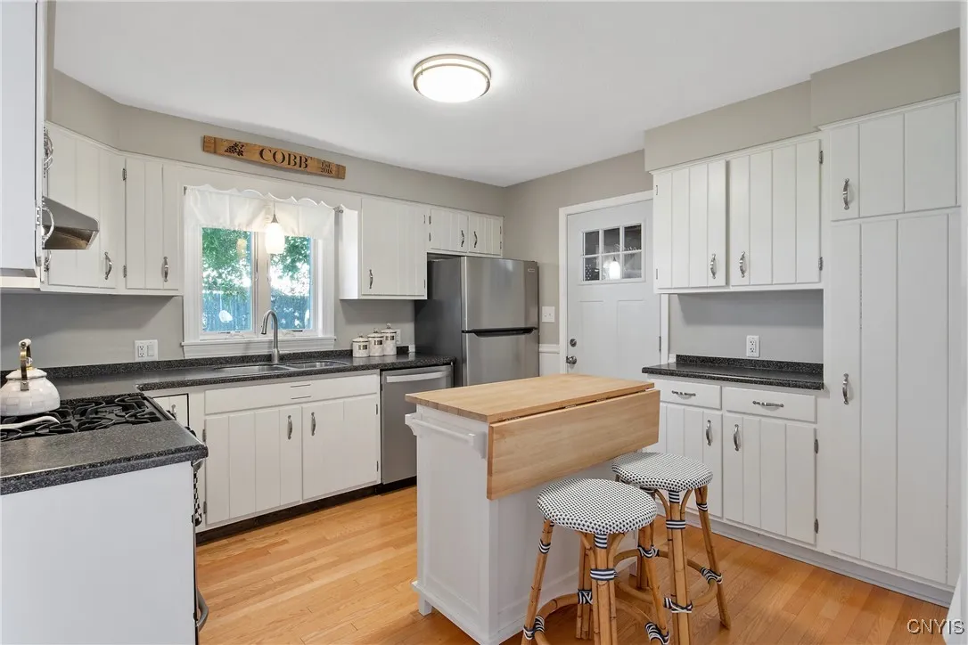 Nice size kitchen with lots of cabinets and a pantry cabinet.