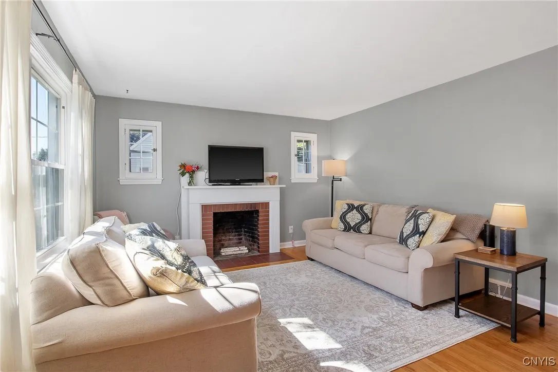 Cozy living room filled with natural light and beautiful hardwood floors