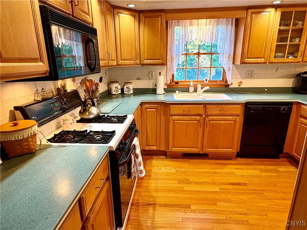 Updated kitchen with loads of cabinet and counter space.