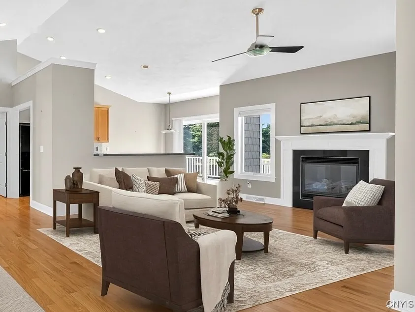 Living room with gas fireplace - virtually staged furniture.