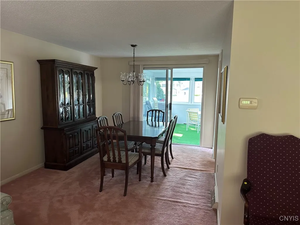 dining room (unfinished hardwoods under carpet)