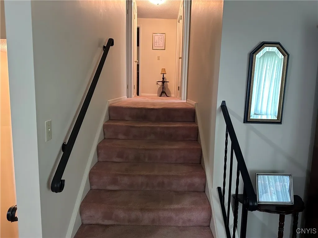 hallway to bedrooms finished hardwoods under carpet