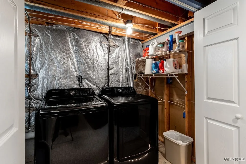 Washer and dryer just off this basement living room