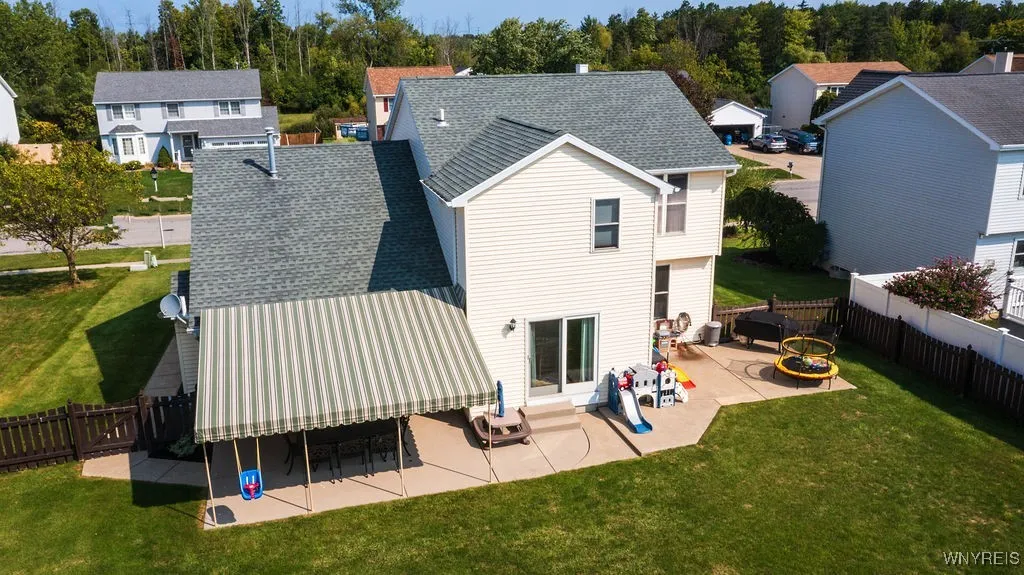 Patio with dining, grilling and play areas