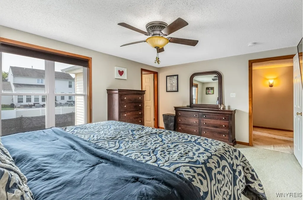 Primary bedroom with ensuite full bath and walk-in closet