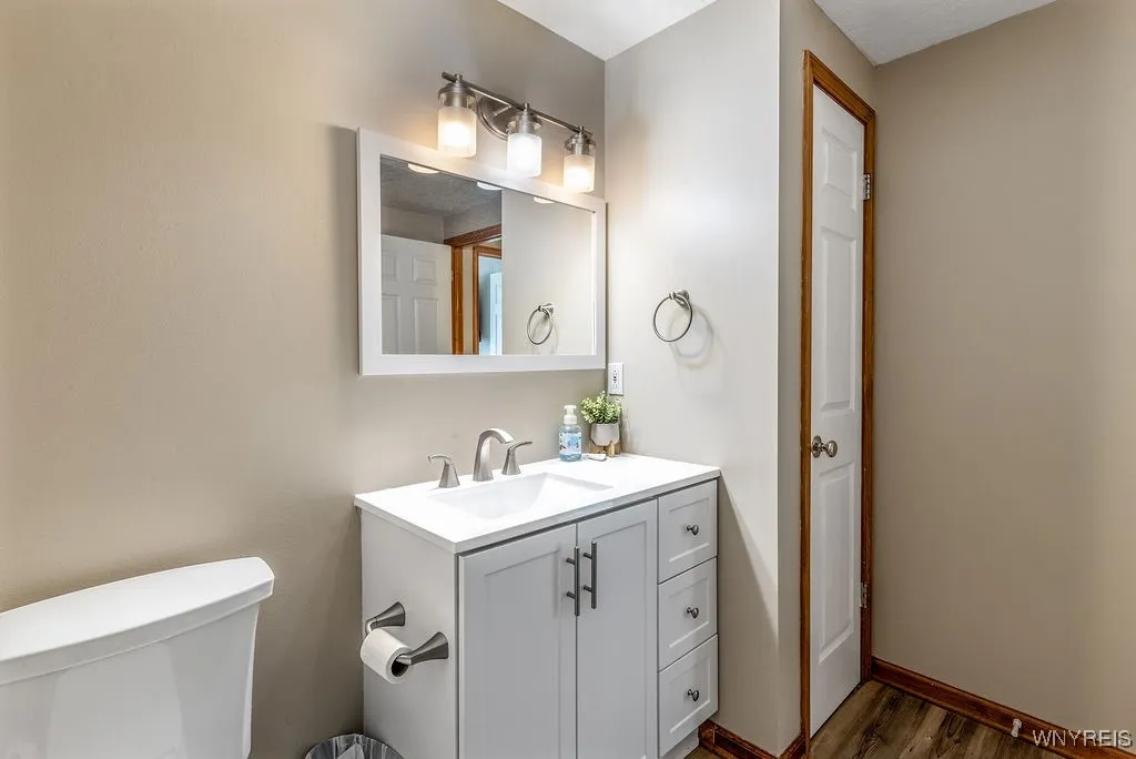 Common full bath also features a linen closet