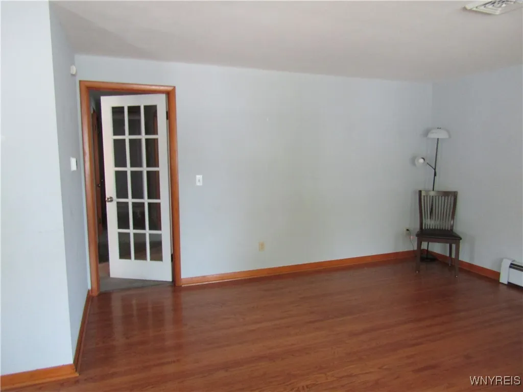 french door off living room to hallway and bedroom, office\n