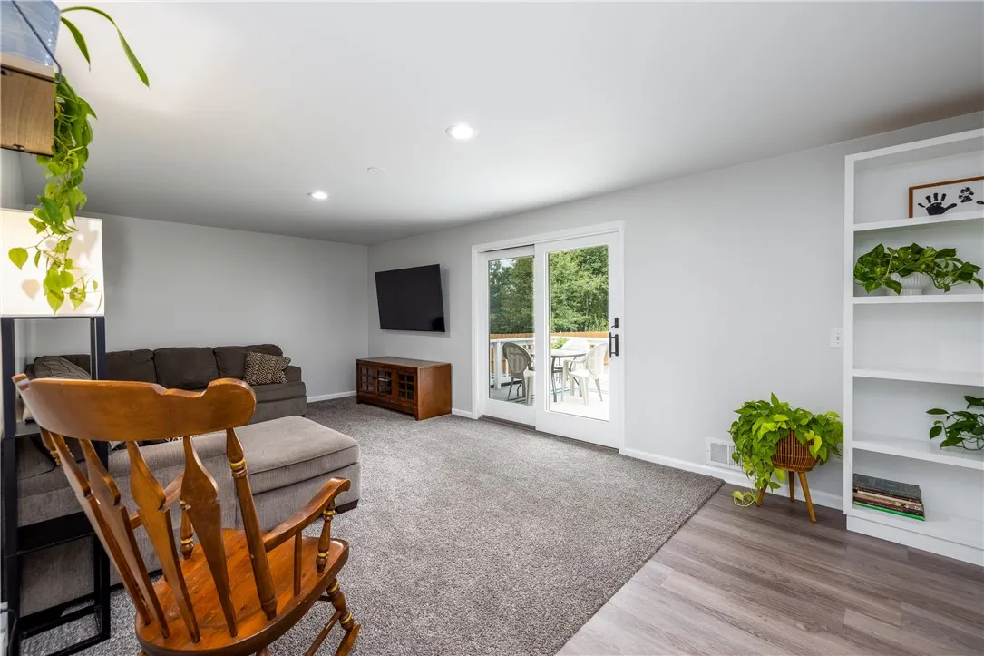 Family room with sliding glass doors leading to back deck