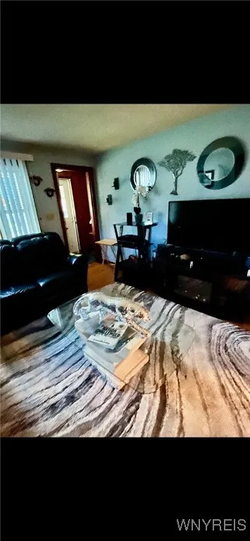 Spacious living room with original hardwood flooring