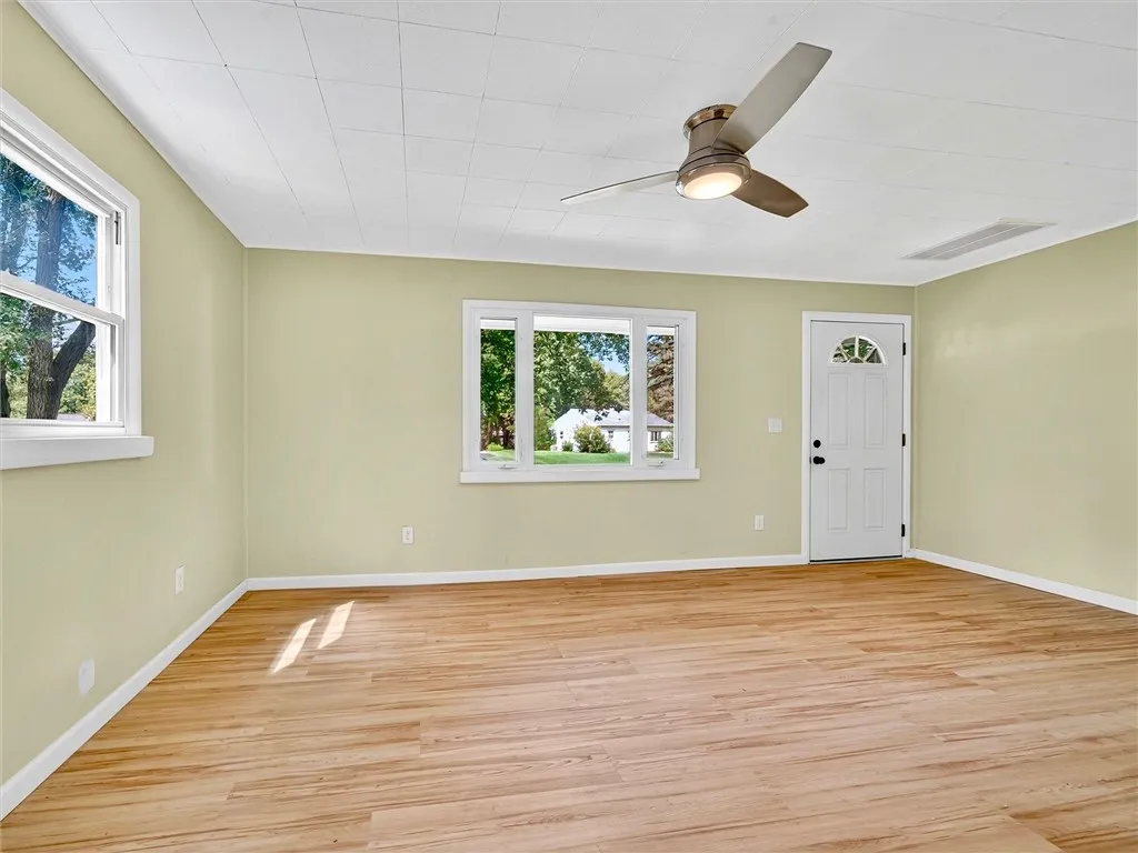 Living room and front door. Luxury laminate floors throughout