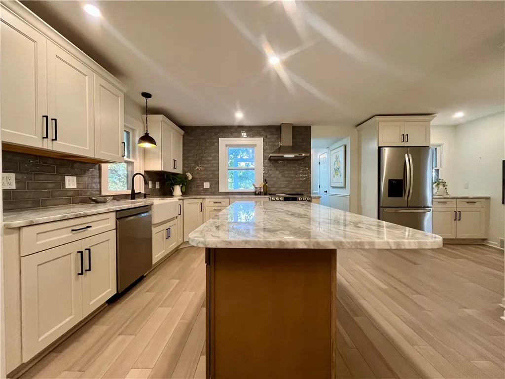 Soft-close Kemper cabinetry and a large island for additional counterspace and seating
