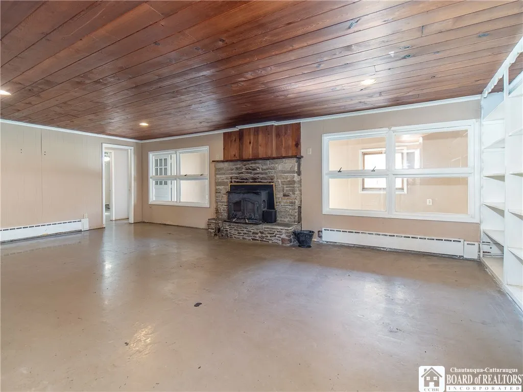 Large family room with wood stove/fireplace.