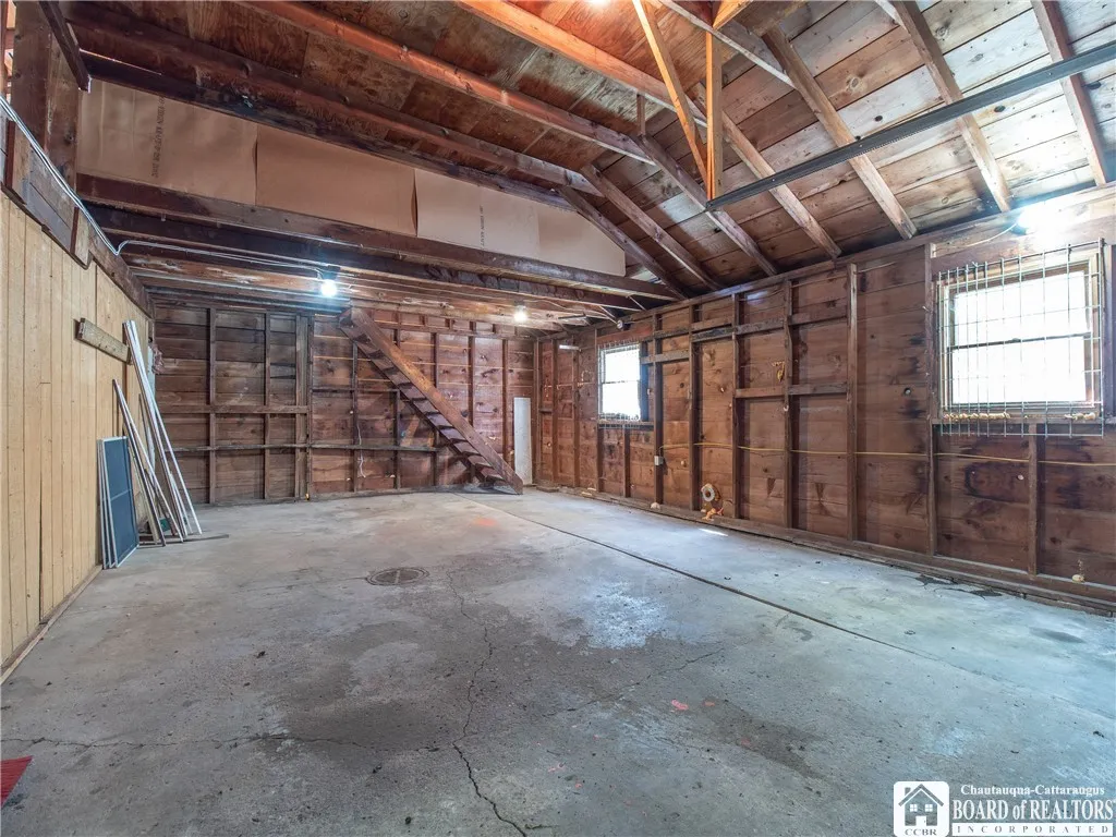 Attached garage with loft storage.