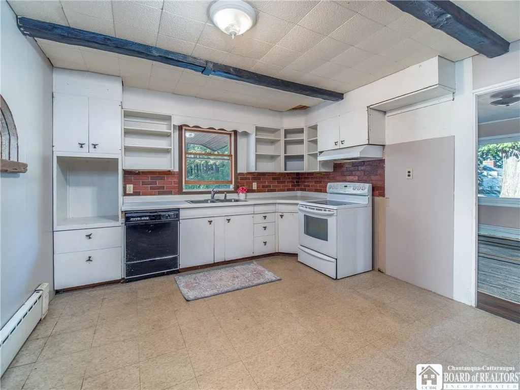 Original kitchen with laundry hook-ups.