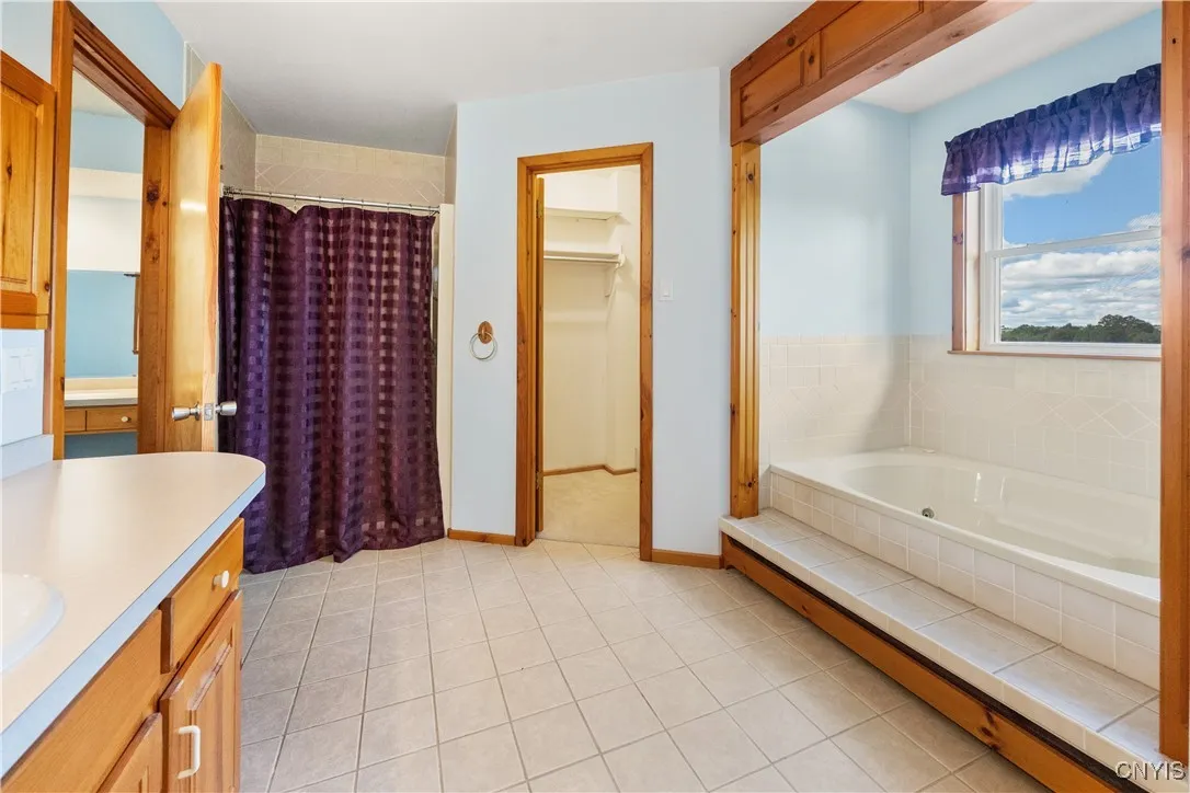 Primary Bathroom with two walk in closets