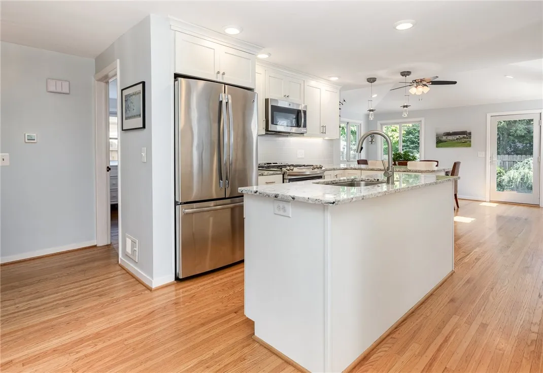 Stunning Kitchen with SS GE appliances, soft close cabinets.