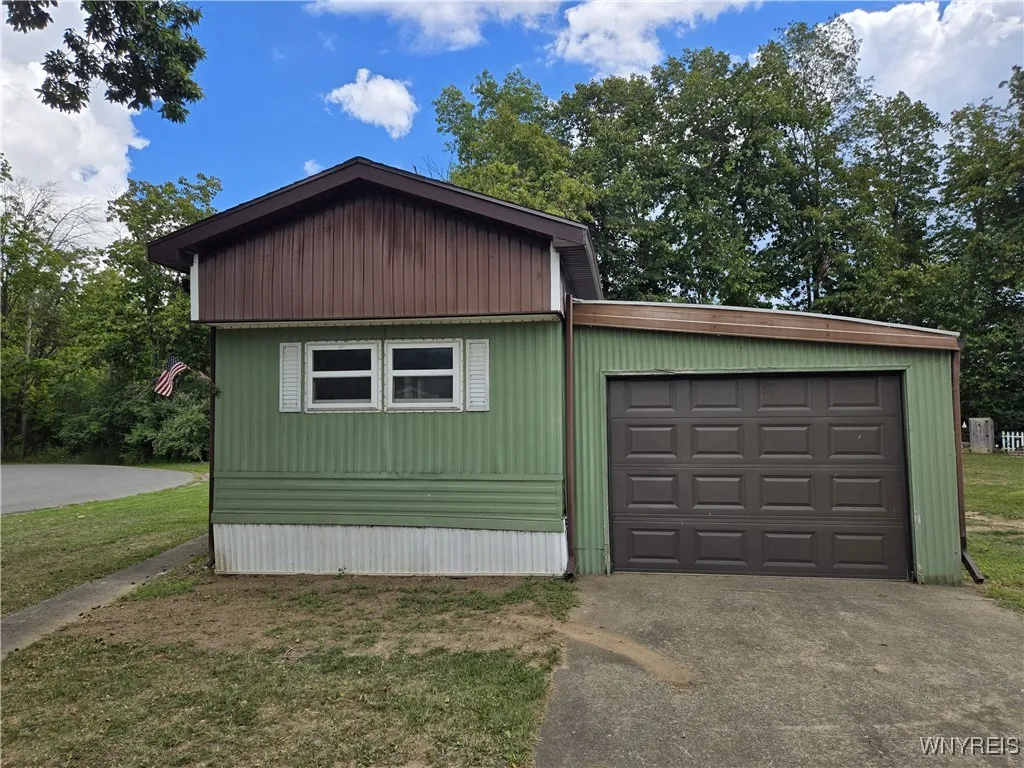 side view with double paved driveway, 1 car garage automatic door opener