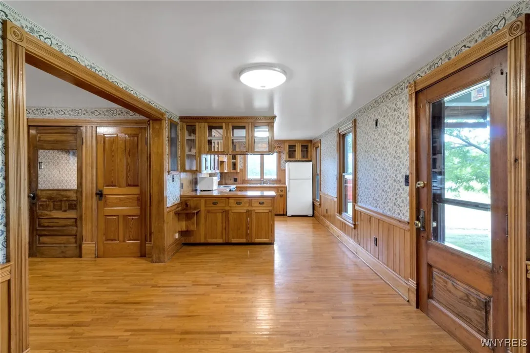 dining area with exterior door to side porch