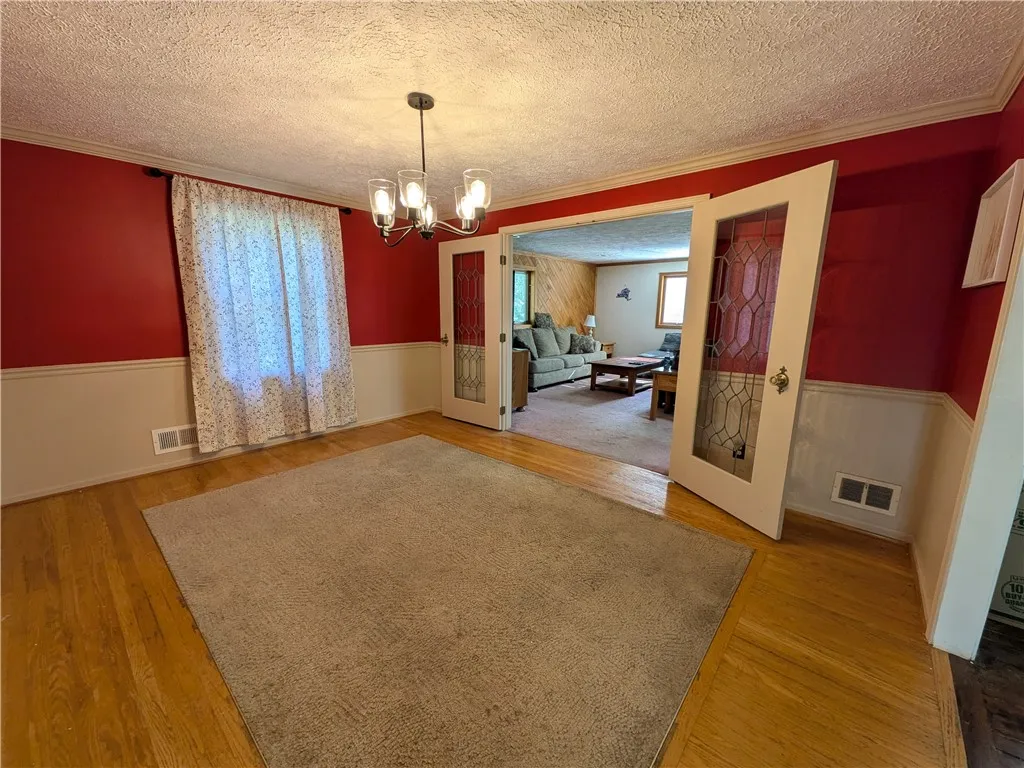 Large dining room with wainscotting