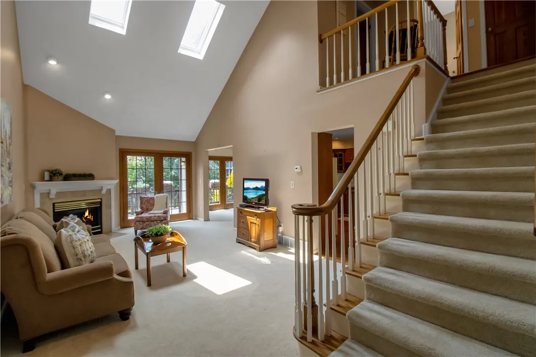 view from foyer into vaulted ceiling living room