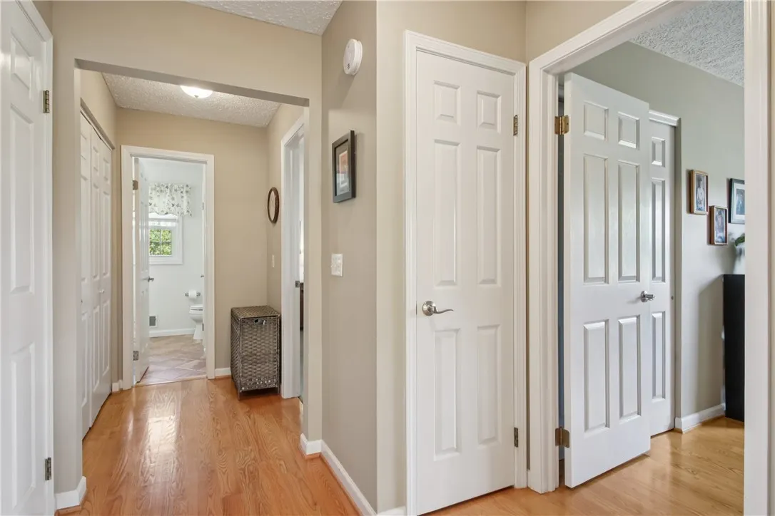 side entry hallway from garage. Laundry closet on left