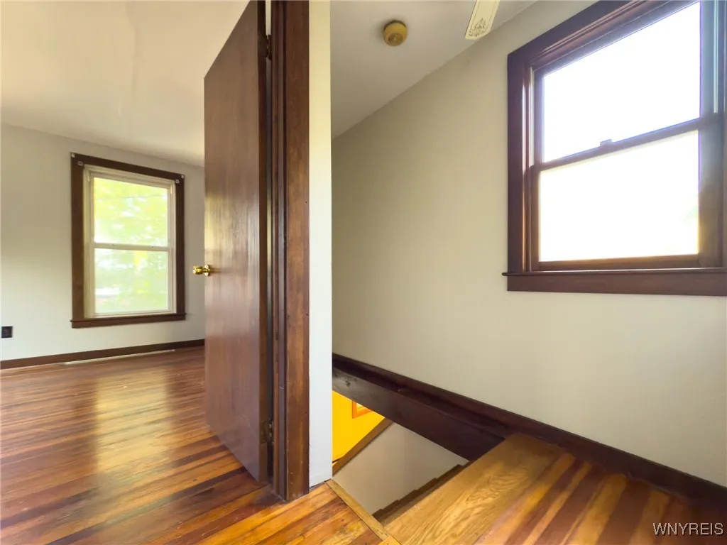 Bedroom with hardwood flooring