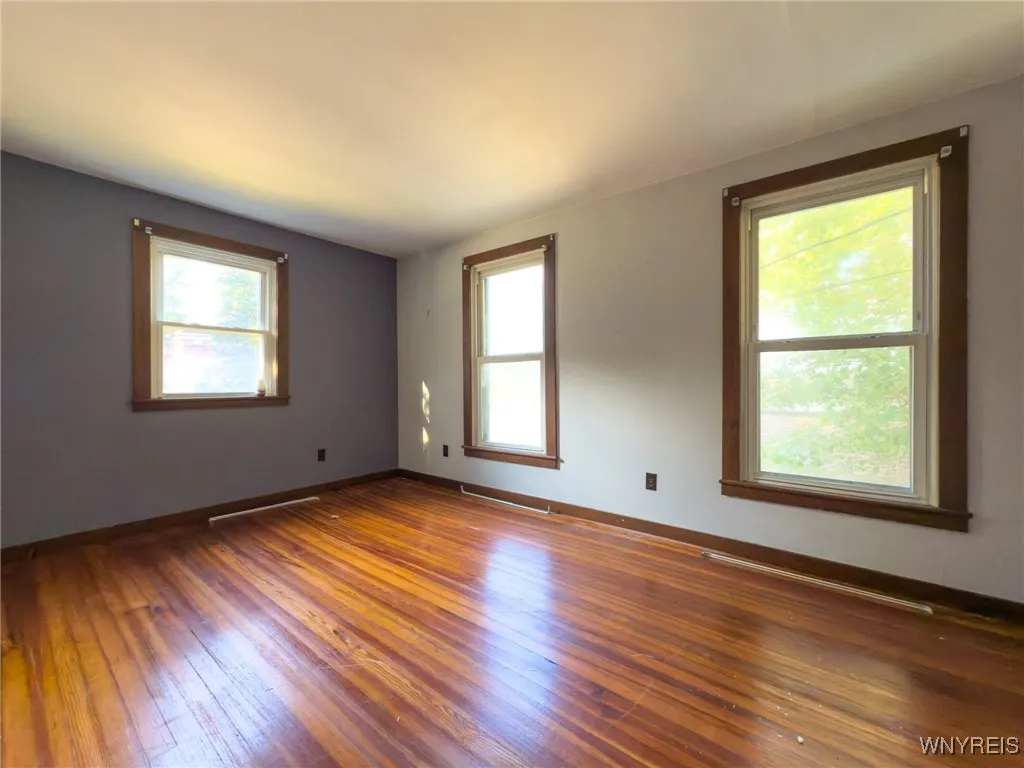 Bedroom with hardwood flooring