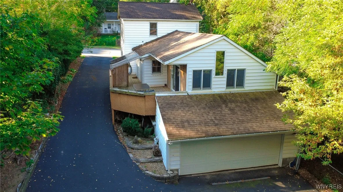 Overhead Rear view of home with 2 car garage