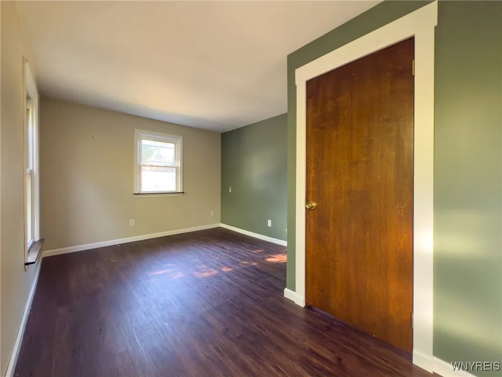 Bedroom 1 with hardwood flooring