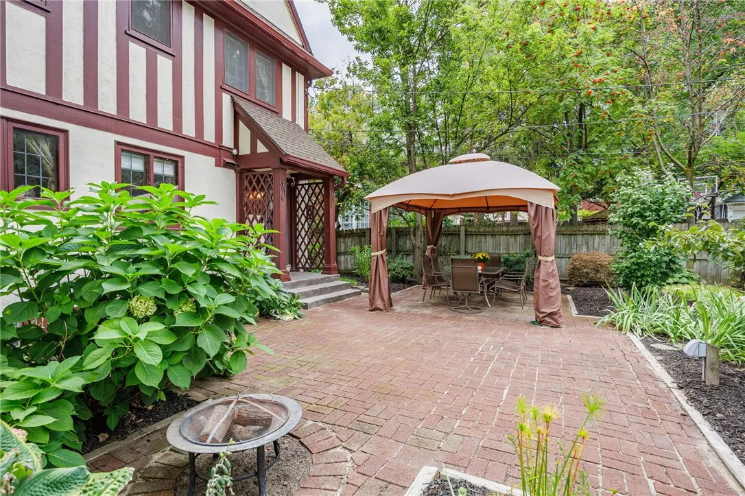 Patio with gazebo for outdoor dining or evening fires.
