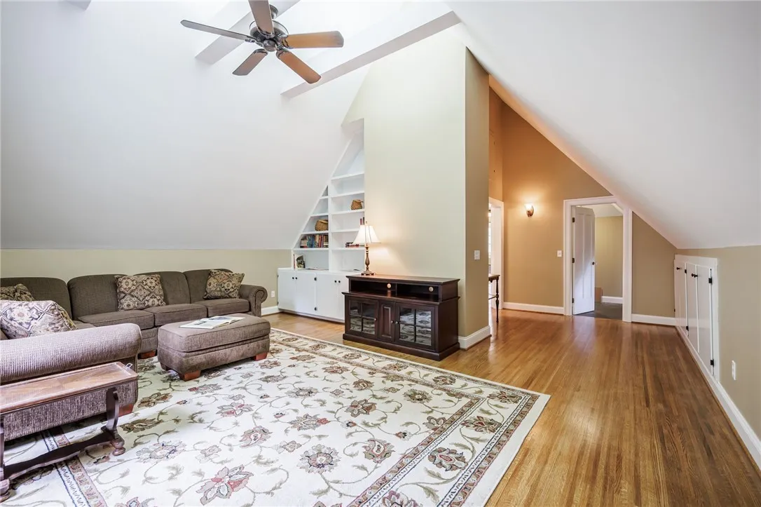 3rd Floor Family Room with soaring cathedral ceilings, new drywall, and lighting.