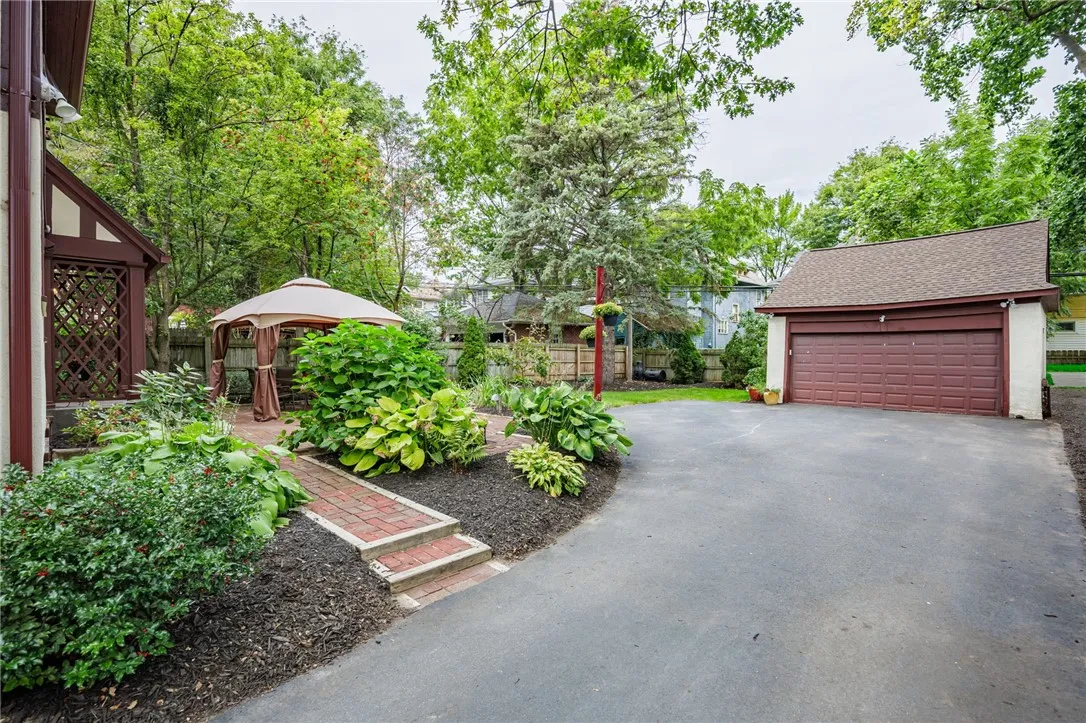 New driveway(2023) leads to a private fully fenced back yard