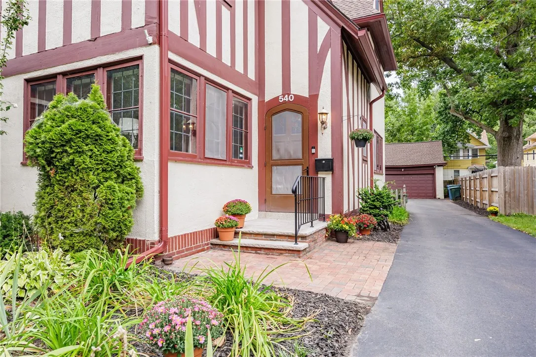 Front door with stained glass opens to a vestibule.