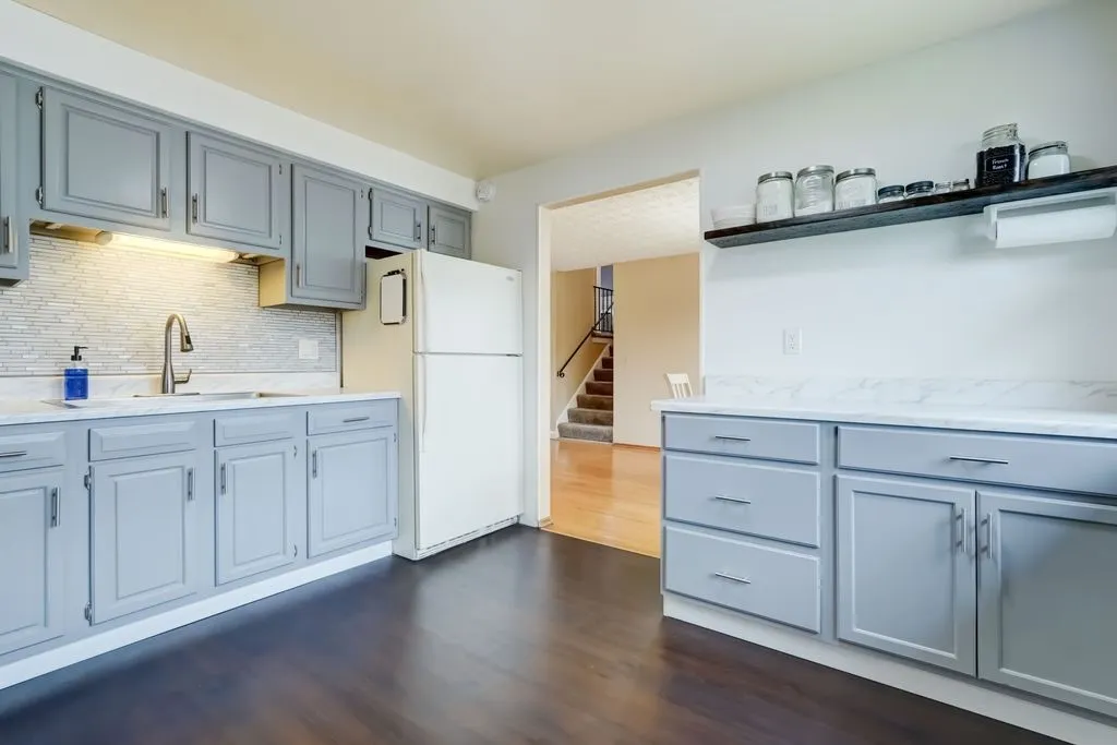 Wonderfully updated kitchen with refinished cabinetry, tile backsplash and all appliances included!