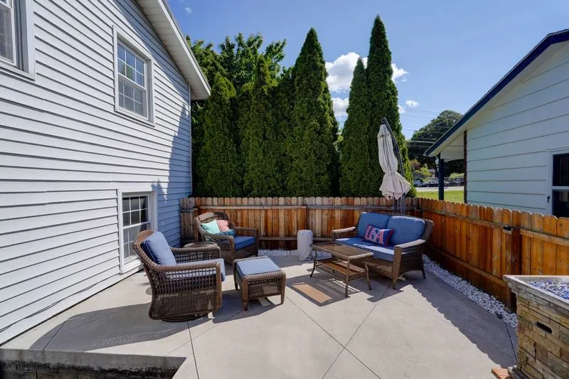 Wonderfully private new back patio with privacy fencing, fire pit and more!