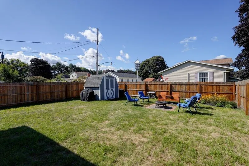 An alternate perspective of the side yard from the corner of the garage.