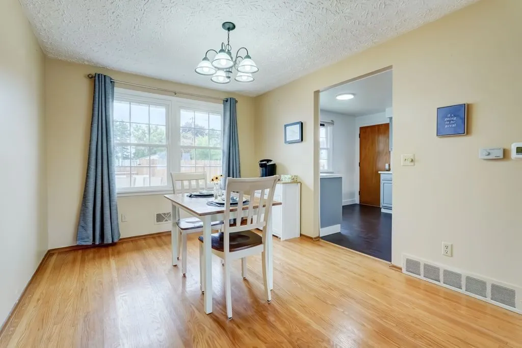 A closer view of the dedicated dining area with a glimpse of the kitchen to the right.